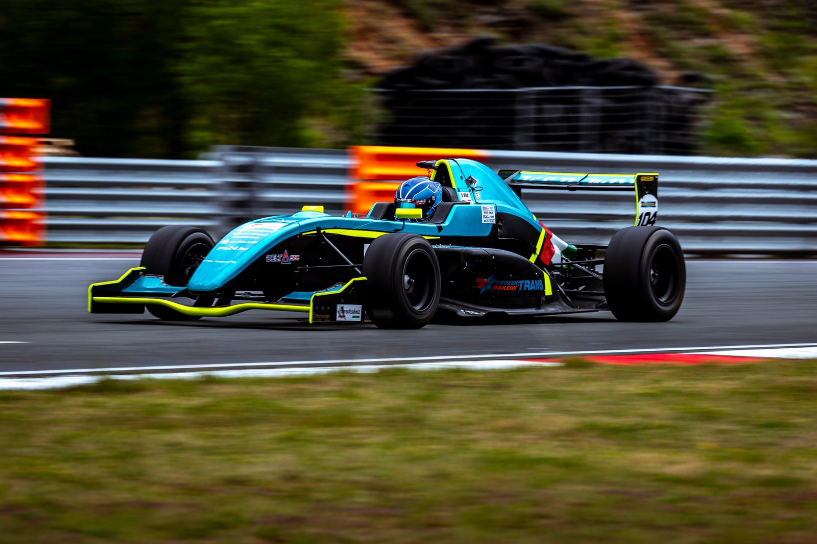 Formula car at speed on circuit